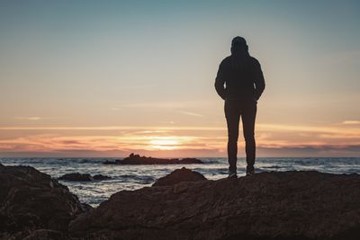 standing at sun rise